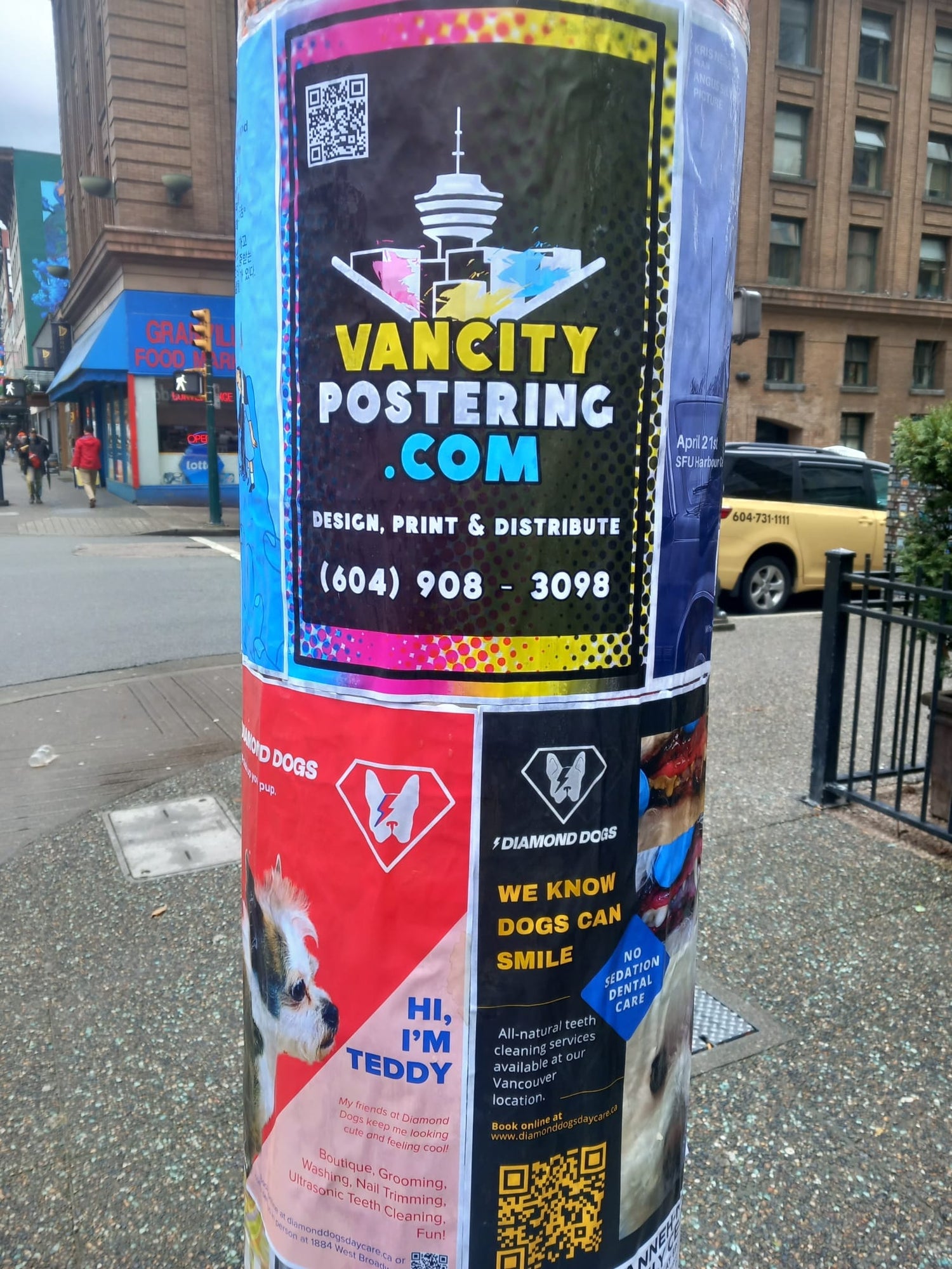 van city postering posters on a lamp post